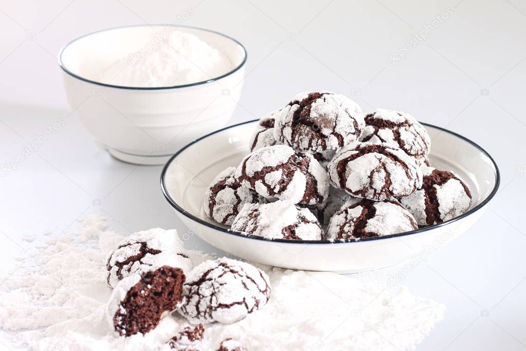 Chocolate cookies with cracks on a white background