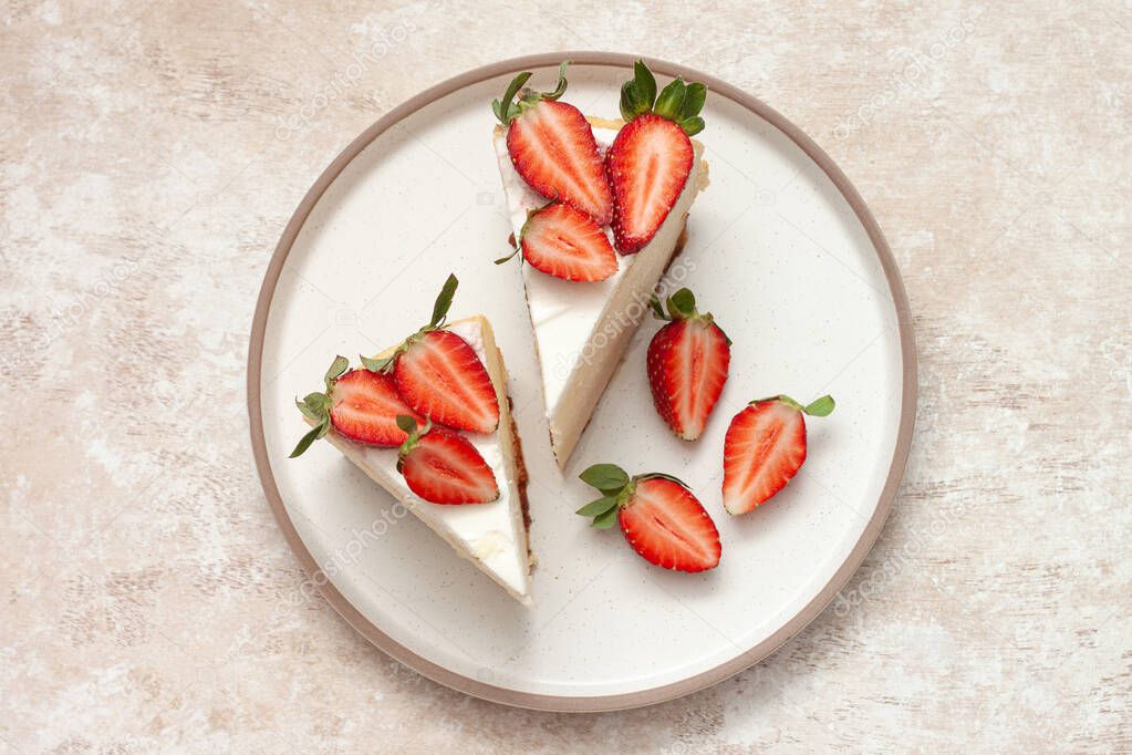 Homemade cheesecake with fresh strawberries and mint leaves