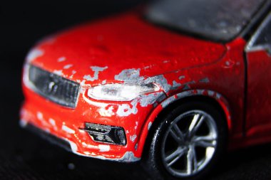 red car with broken front and stripped varnish clipart