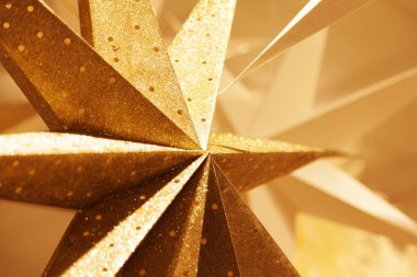 various Christmas stars in gold and cardboard clipart