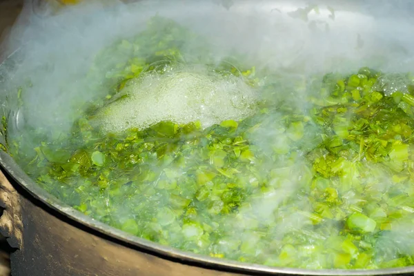 Brassica,vegetable leaves in boiling water, — Stock Photo, Image