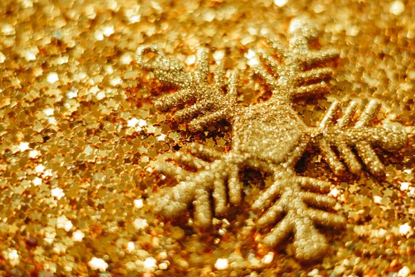 Arany karácsonyi háttér ragyog a csillagok. Homályos — Stock Fotó