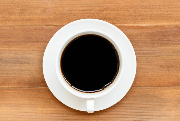 Up z czarnej kawy na brązowym tle drewnianych — Zdjęcie stockowe