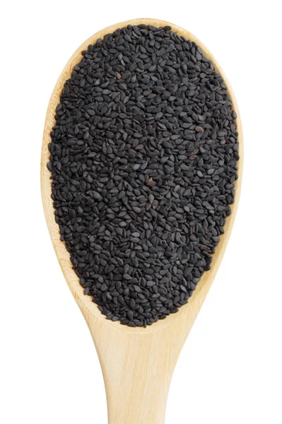 Black sesame in wooden spoon isolated on white background — Stock Photo, Image