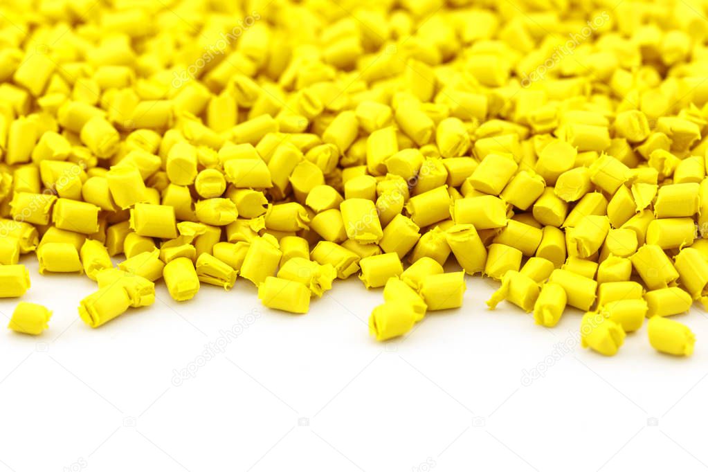 yellow plastic resin ( Masterbatch ) on white background