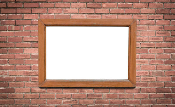 Blank brown wooden picture frame on the old brick wall backgroun