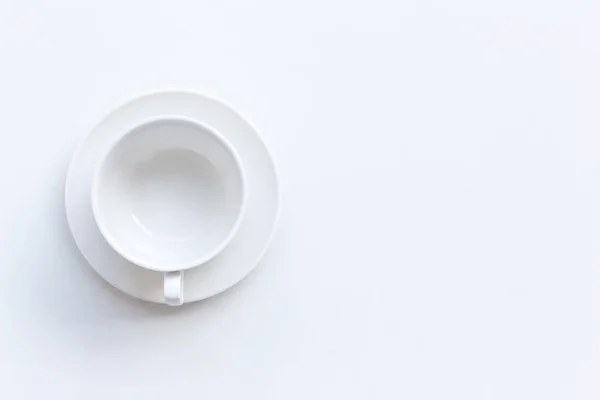 Top view of blank coffee cup on white table — ストック写真