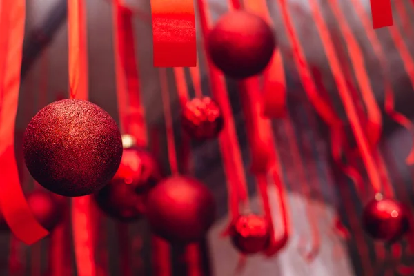 Beautiful Christmass and New Year decoration - red shiny ribbons and balls. — ストック写真