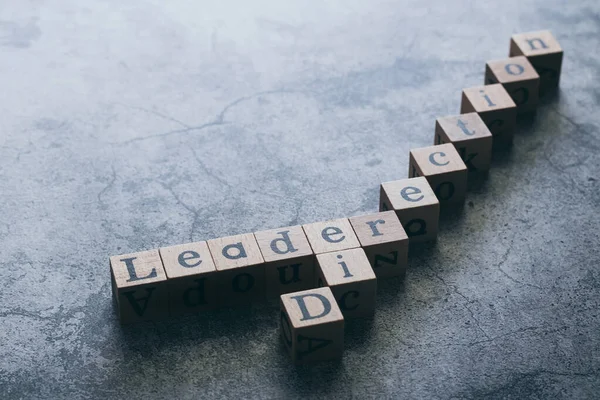 Wood cube letter word of Leader and Direction with copy space. Idea of motivation or inspiration in business vision and corporate management strategy. Leadership lead team to reach goal or achievement — Stock Photo, Image