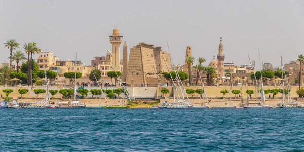 River Nile and the Egyptian temple, view from a boat, Luxor, Egypt