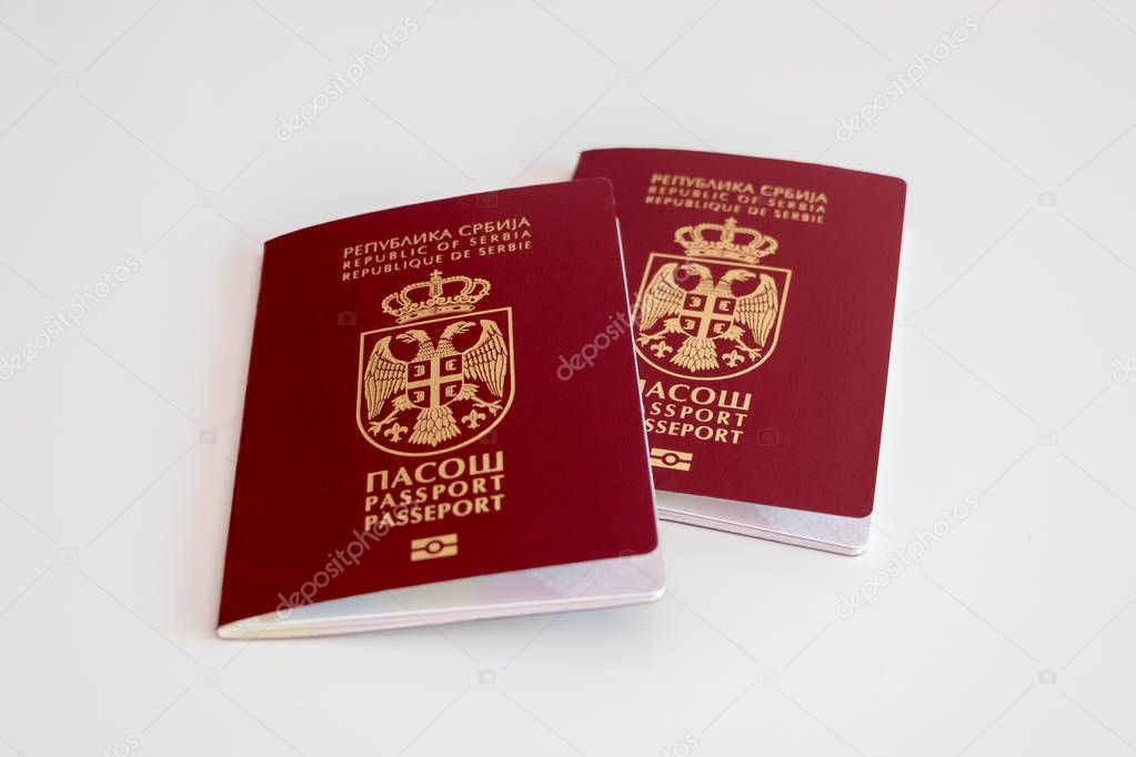 Two Serbian passports on white background, selective focus, concept