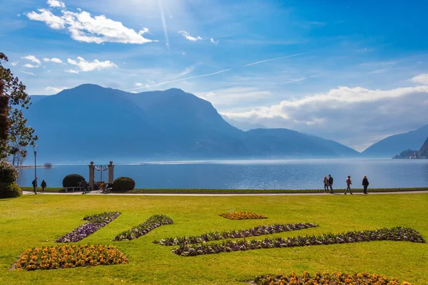 Lugano, Switzerland - March 10, 2019: Beautiful picturesque view on the Lake Lugano and Swiss alps — Stock Photo, Image