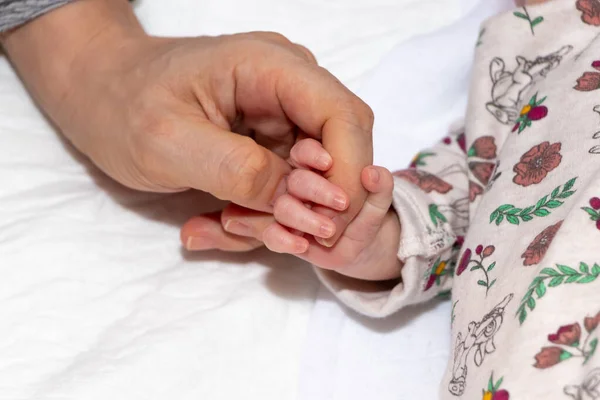 Close Main Focus Newborn Baby Hand Holding Finger Her Mother — Stock Photo, Image