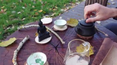 Slow motion tea ceremony. The tea cup