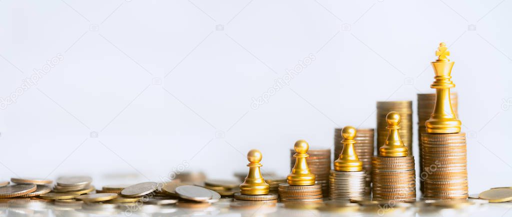 Chess gold stand on stack of coins. Business leader concept for market target strategy. investment and development concept.  finance and business concept. Competition and winners in doing business.