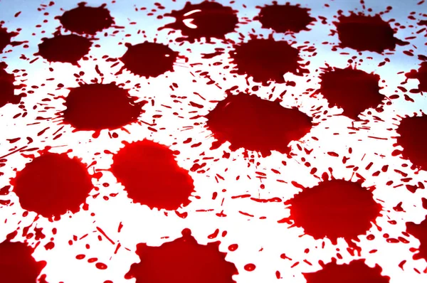 Red drops of blood with splashes on a white background — ストック写真