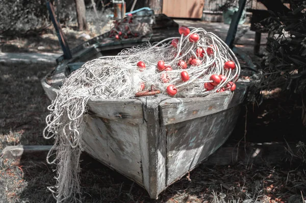 Old boat on land with slave nets