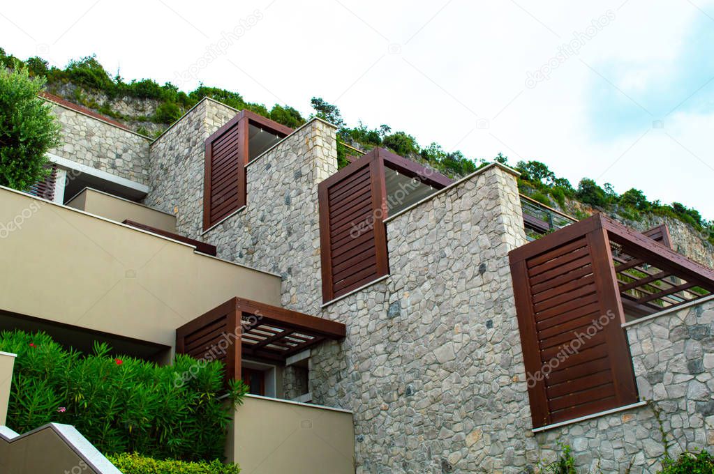 Beautiful row houses are built on a cliffside in detail