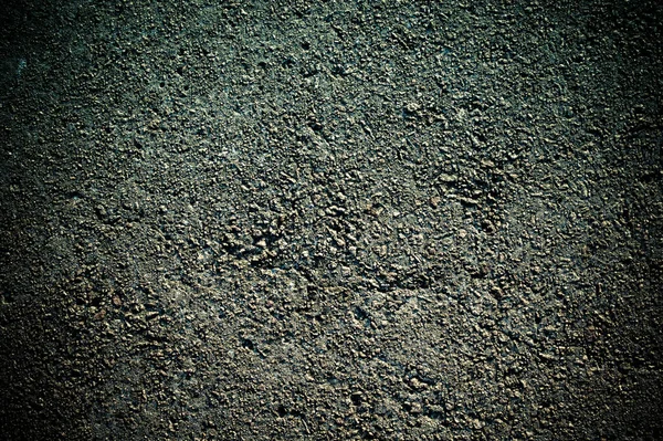 Powierzchnia betonu z płaskorzeźbą i pęknięciami — Zdjęcie stockowe