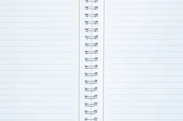 Notebook binding with white blank sheet in detail