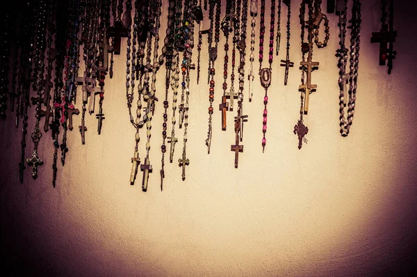 Many crosses with the crucifixion of Christ close up. Religion concept.