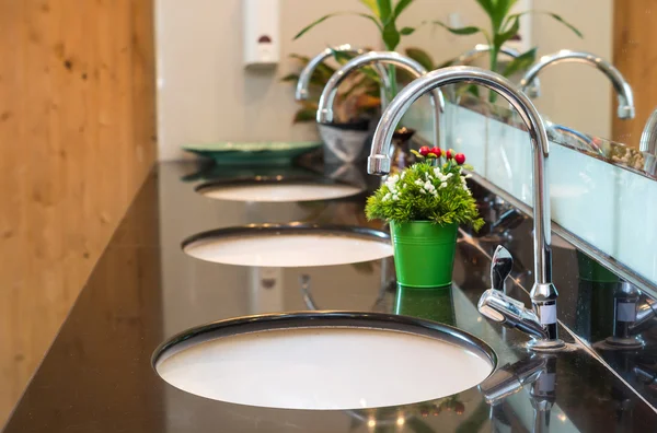 Luxury Chrome faucets with washbasins — Stock Photo, Image
