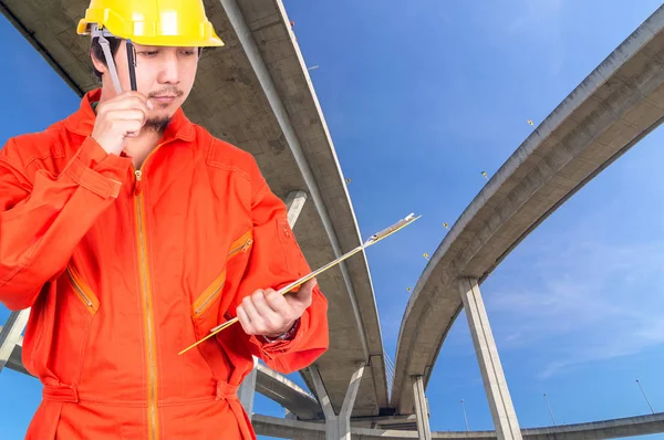 Asian engineer  holding the note pad — Stock Photo, Image