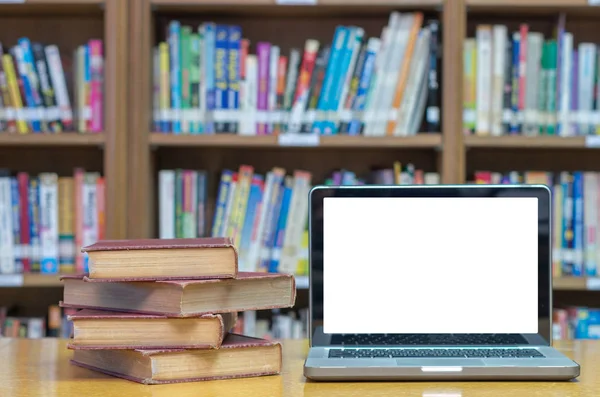 Old book on the desk in library — Stock Photo, Image