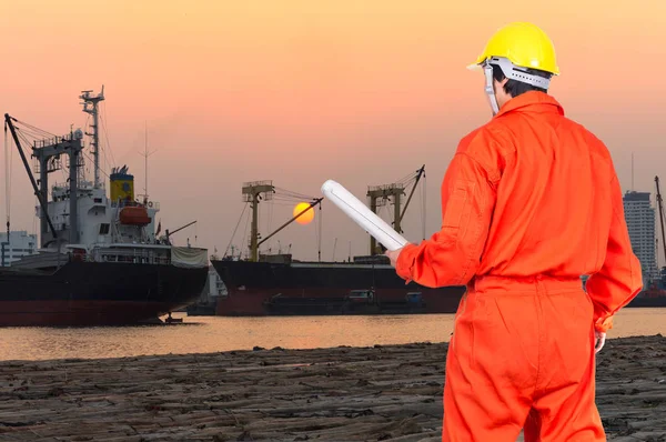 Asian engineer holding at the blueprint — Stock Photo, Image