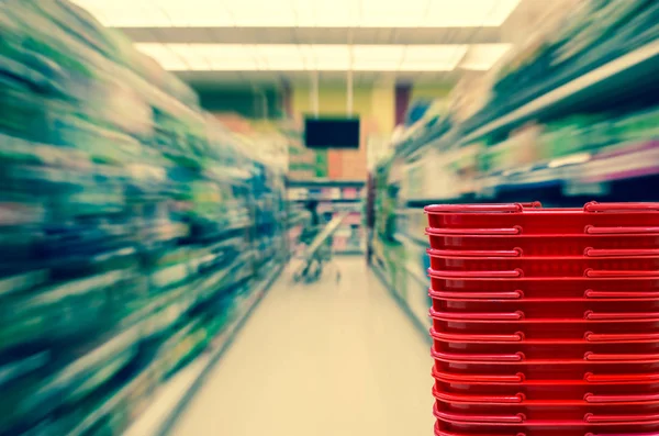 Store with red color basket — Stock Photo, Image