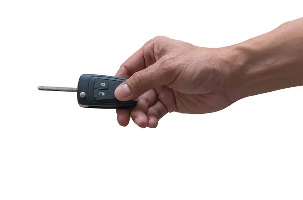 Мужчина держит в руке ключ от машины — стоковое фото