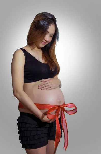 Pregnant woman on  background — Stock Photo, Image