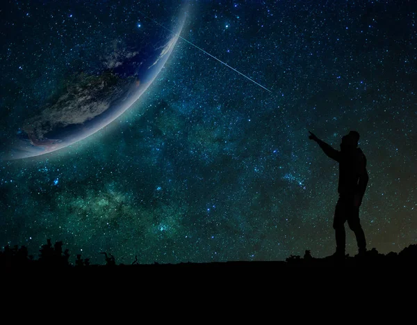 Man who standing and pointing to earth — Stock Photo, Image