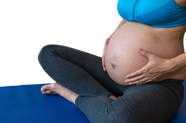 Hamile kadın egzersiz yaparak — Stok fotoğraf