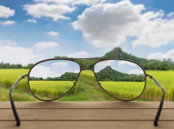 Landscape focused in glasses lenses — Stock Photo, Image