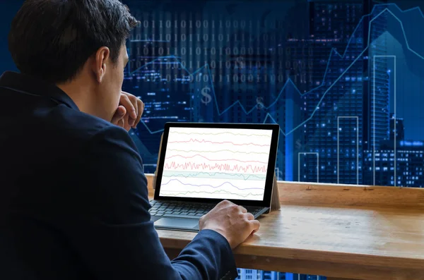 Businessman sitting and using computer laptop