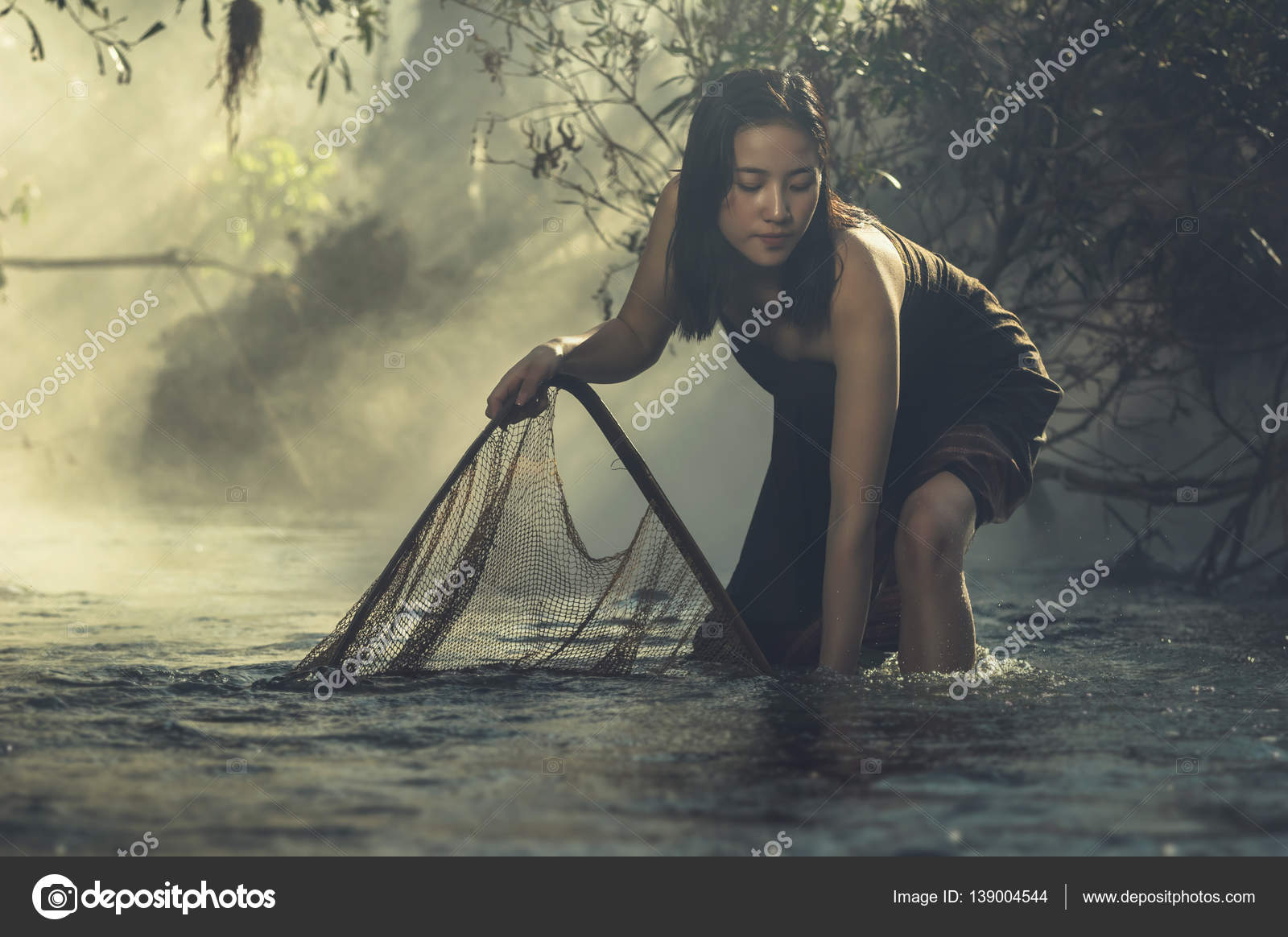 Woman fishing at sunrise Stock Photo by ©Tzido 139004544