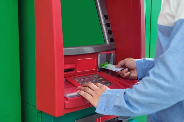 insert ATM card into bank machine