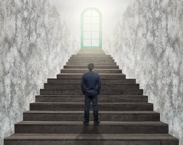 Businessman standing for walking up stairs — Stock Photo, Image