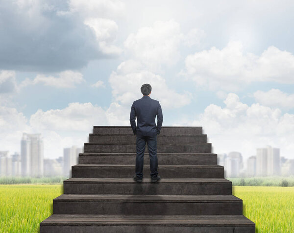 Businessman standing for walking up stairs
