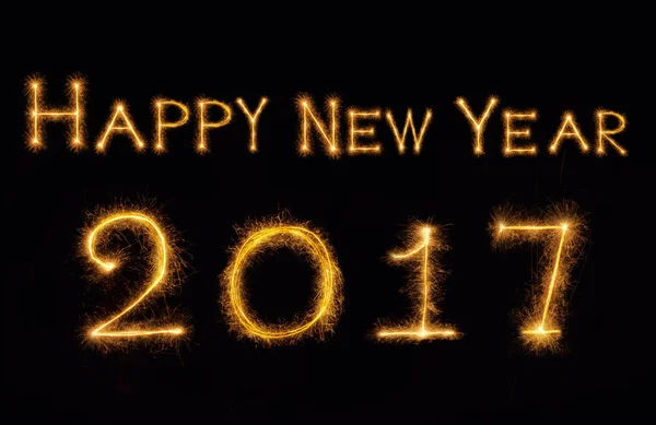 Happy new year 2017 written with Sparkle firework on black backg