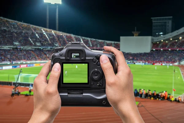 Hand holding the camera — Stock Photo, Image