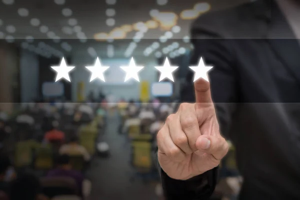 Businessman pointing five star — Stock Photo, Image