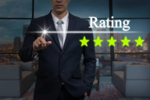 Businessman pointing five star button — Stock Photo, Image