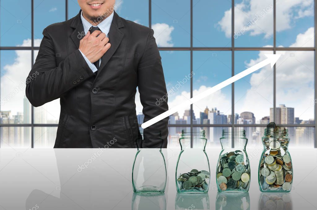 Businessman with Step of coins bottle 