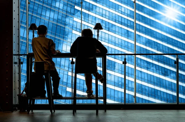 Silhouette of Men works at the workplace