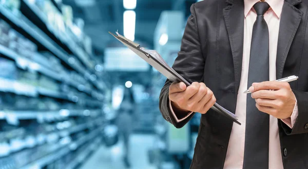 Businessman writing the file pad — Stock Photo, Image