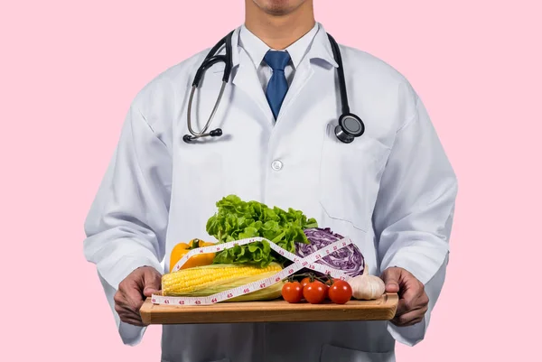 Doctor holding fresh vegetables — Stock Photo, Image