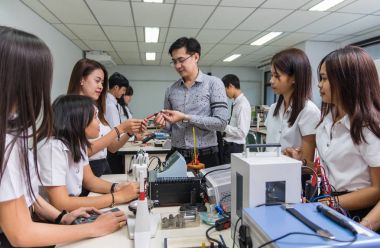 Asian teacher Giving Lesson  clipart