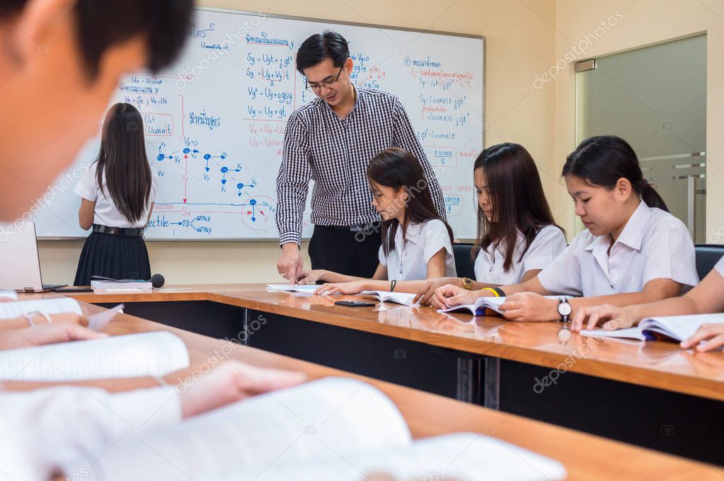 Asian teacher Giving Lesson 